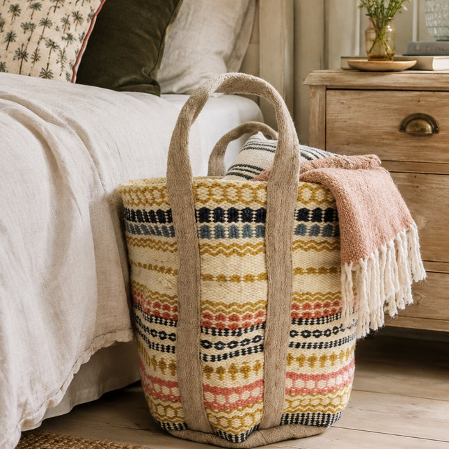 Fiona Walker extra large multicolour woven jute storage basket with handles styled in the bedroom