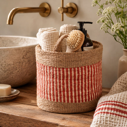 Fiona Walker small rust stripe woven jute storage basket styled in the bathroom
